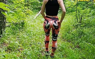 Public masturbation, a girl in leggings walks in nature and